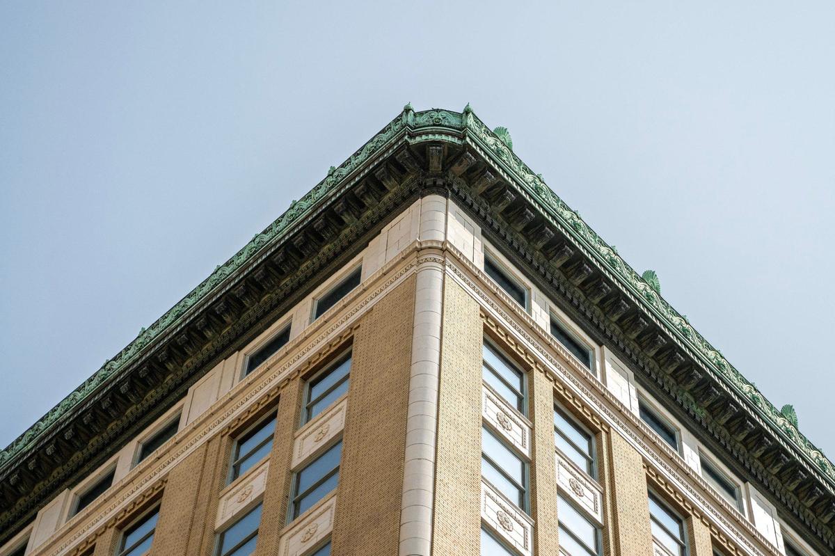 The Midland Lofts has weathered copper at the top of the building.