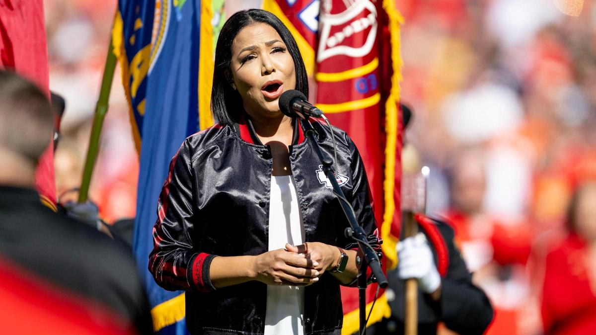 Good Morning America reporter Stephanie Ramos sings the national anthem before an NFL football game between the Kansas City Chiefs and the Chicago Bears at GEHA Field at Arrowhead Stadium on Sunday, Sept. 24, 2023, in Kansas City. Ramos, a major in the Army Reserve, was a reporter and anchor for KMBC channel 9 from 2012 until 2015.