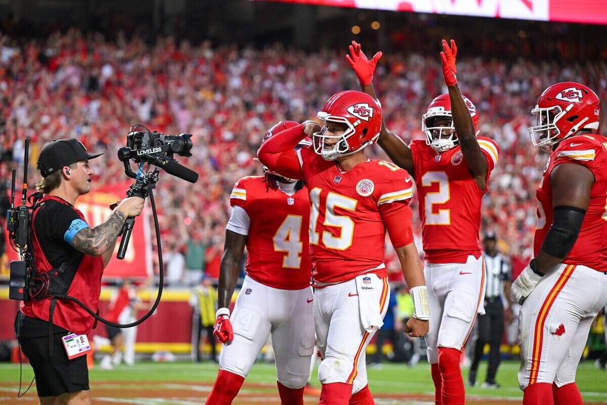 Kansas City Chiefs quarterback Patrick Mahomes (15) celebrates after scoring a touchdown in the first quarter of the Kansas City Chiefs vs. Denver Broncos NFL season opener at Arrowhead Stadium in Kansas City on Sept. 14, 2026.