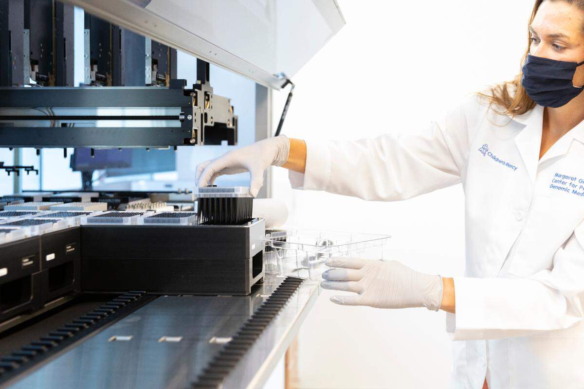 A researcher works in the genetics lab at Children’s Mercy Hospital in Kansas City. The clinic recently announced that it has diagnosed over 1,000 patients, most of them children, with known rare diseases using genetic sequencing.