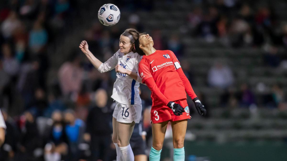 Kansas City defender Kristen Edmonds (3) heads the ball away from OL Reign midfielder Rose Lavelle (16) during the game between KC NWSL and the OL Reign on Saturday October 30, 2021 at Legends Field in Kansas City, Kansas.