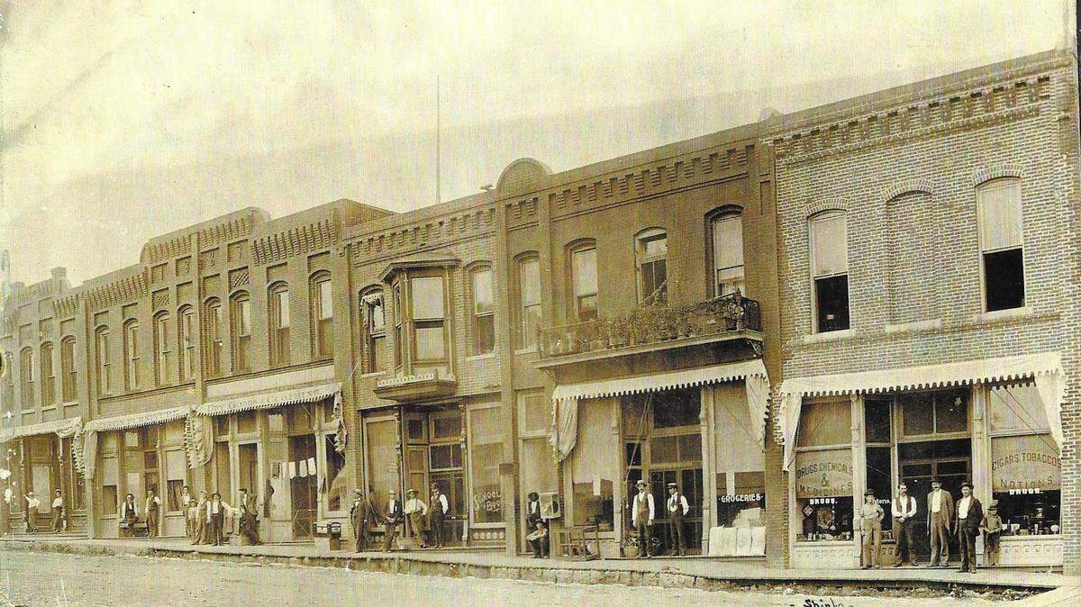 Looking northwest onto S.W. Third from S.W. Main Street in downtown Lee’s Summit. This photo was taken by J. C. Shinkle who operated a photographic studio in Lee’s Summit in 1896.