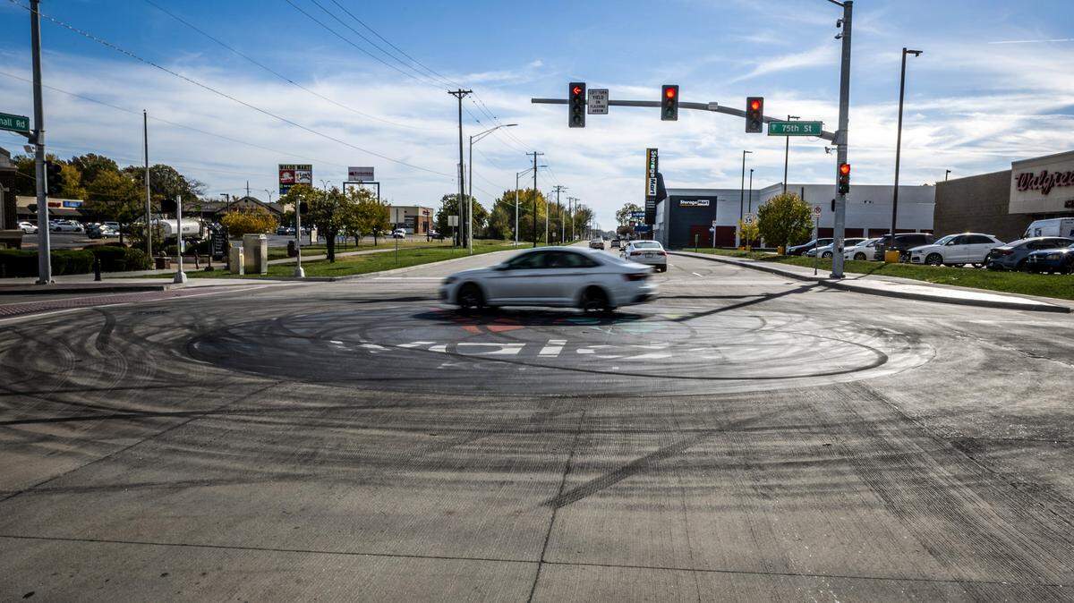 The street art logo in the middle of the intersection of 75th Street and Wornall Road is seen on Tuesday, Nov. 4, 2025, in Kansas City. The recently placed logo which celebrates the Waldo neighborhood was damaged by tire skid marks from an illegal sideshow over the weekend.