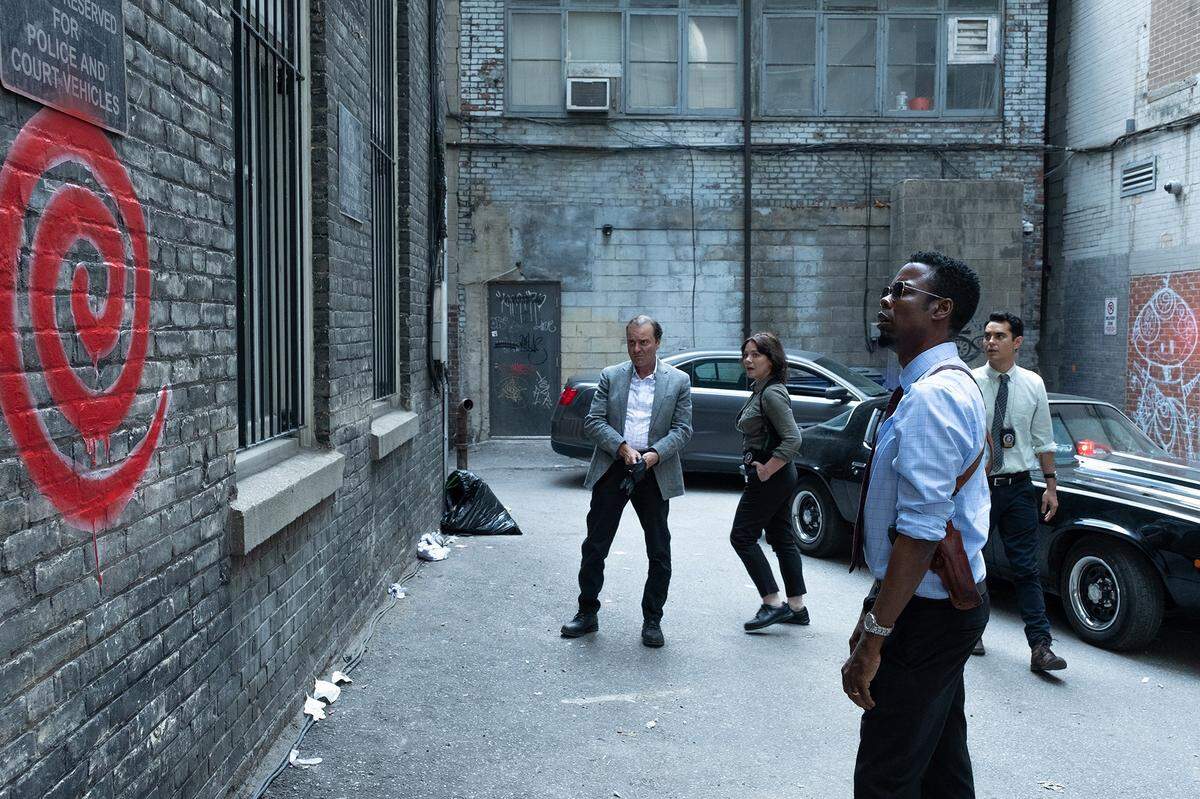 In “Spiral,” crooked cops play a game of cat-and-mouse with a Jigsaw copycat killer. Chris Rock, foreground, stars with Max Minghella, right.