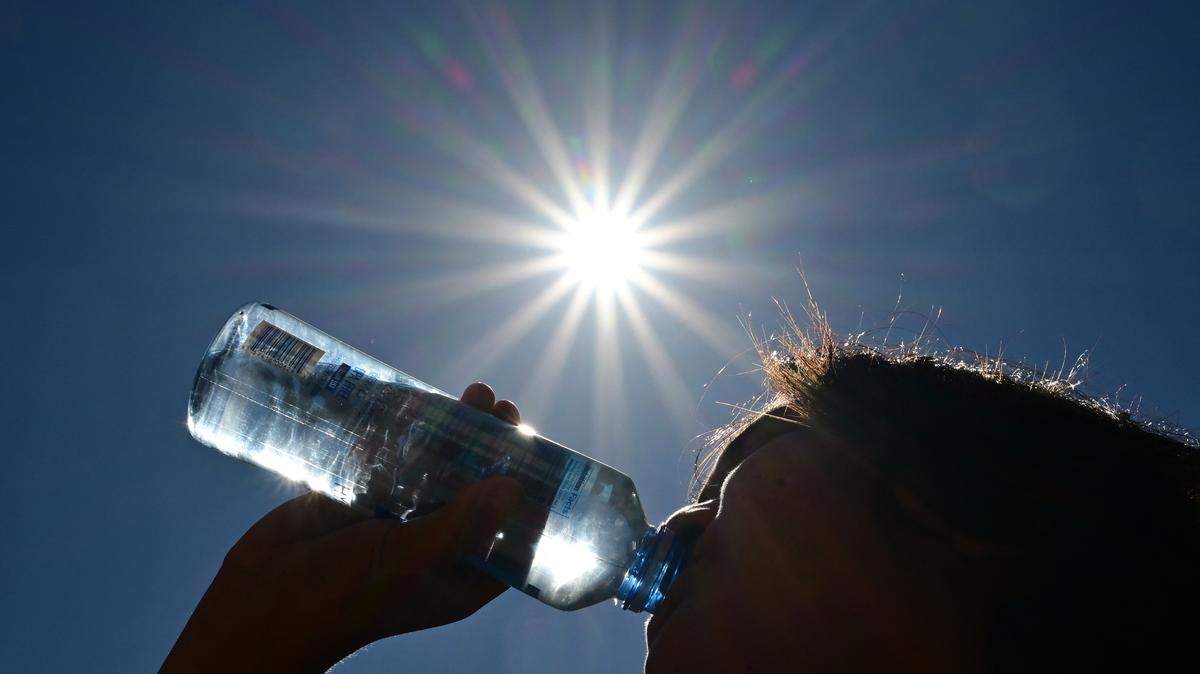 Someone drinking water.
