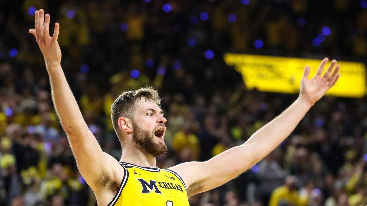 Michigan center Hunter Dickinson (1) celebrates a three-point basket against Michigan State during the second half at Crisler Center in Ann Arbor on Saturday, Feb. 18, 2023.