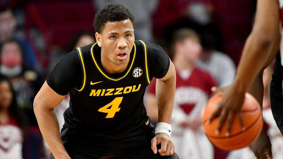 Missouri guard Javon Pickett (4) defends against Arkansas during an NCAA college basketball game Wednesday, Jan. 12, 2022, in Fayetteville, Ark. (AP Photo/Michael Woods)