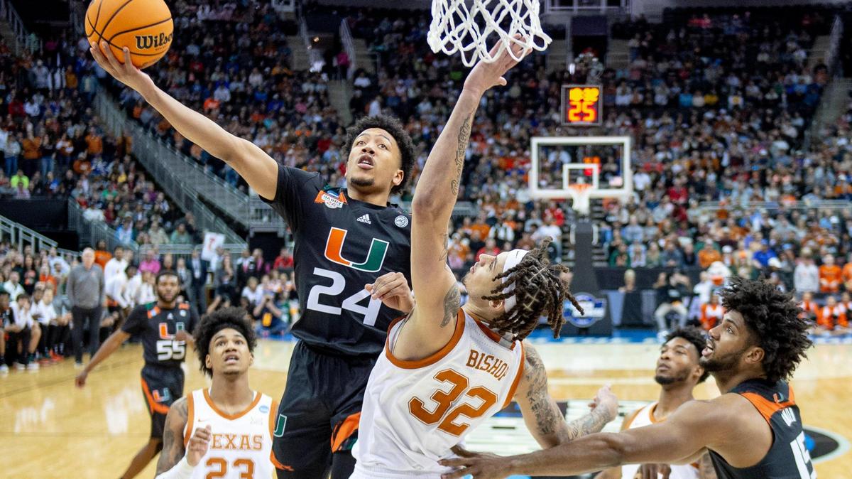 Miami guard Nijel Pack (24) goes up for a shot against Texas forward Christian Bishop (32) during an Elite 8 college basketball game in the Midwest Regional of the NCAA Tournament, Sunday, March 26, 2023, in Kansas City.