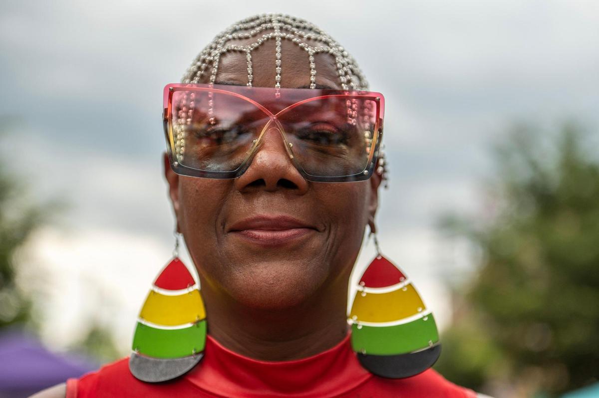 Betty Jone sports Rastafari themed accessories during the Juneteenth KC 12th annual Heritage Festival at the18th and Vine district on Saturday, June 17, 2023, in Kansas City.