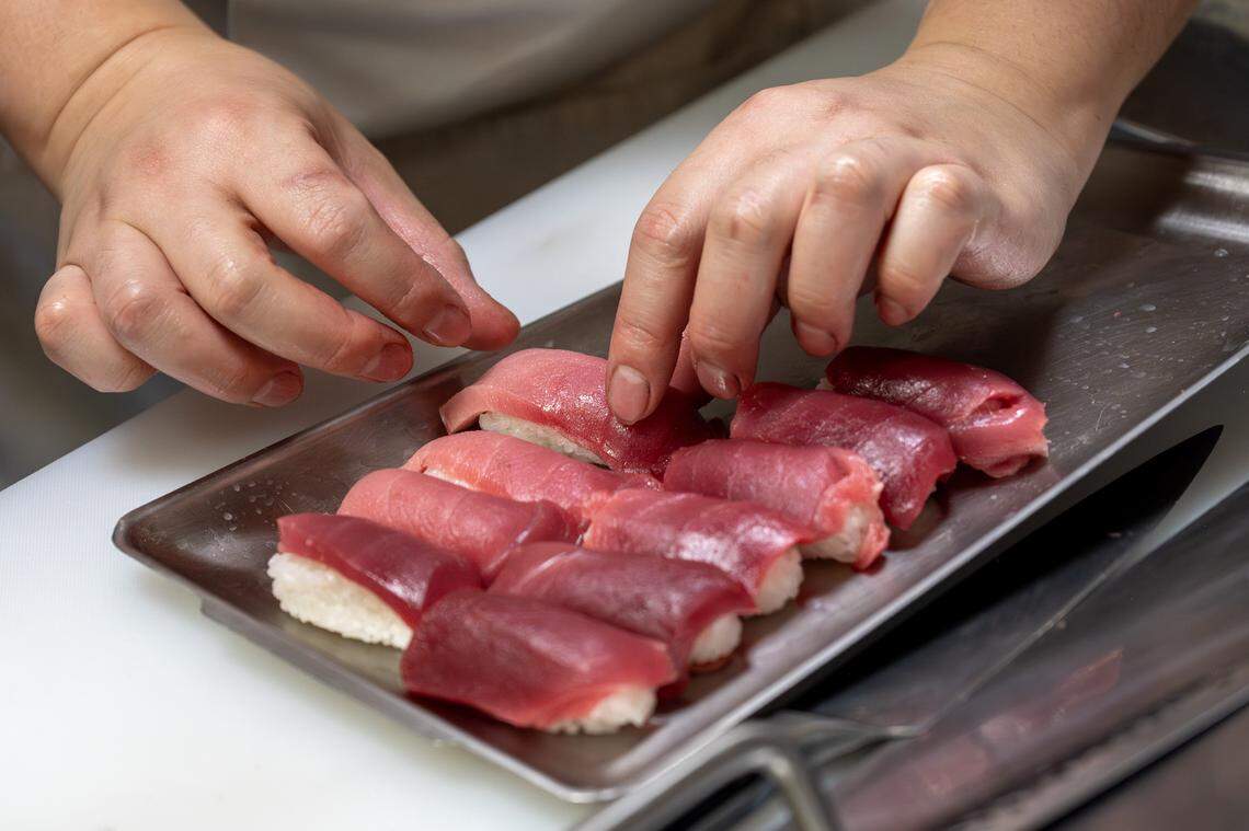 Freshly prepared bluefin tuna nigiri is arranged on a tray during a cutting show at KC Craft Ramen on Monday, March 2, 2026, in Overland Park.
