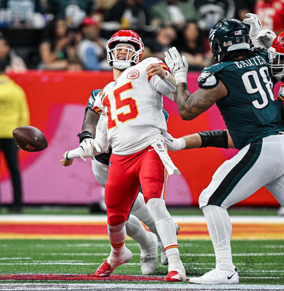 Philadelphia Eagles defensive tackle Milton Williams (93) strips the ball from Kansas City Chiefs quarterback Patrick Mahomes (15) in the fourth quarter during Super Bowl LIX on Sunday, Feb. 9, 2025, in New Orleans. The Eagles recovered the ball on the play.