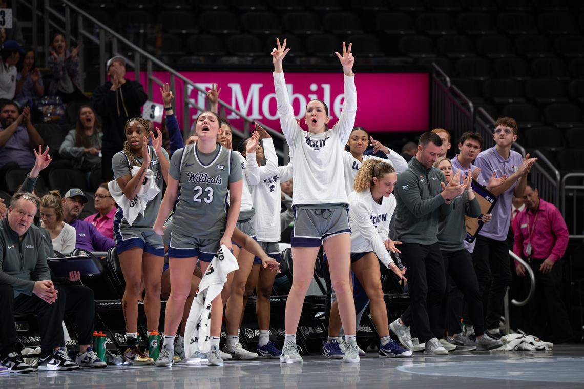 The Kansas State Wildcats bench celebrates a three-point basket against Oklahoma State during the third round of the Big 12 Women’s Basketball Tournament.