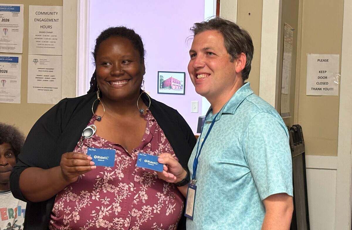 Alana Henry, left, poses with a Kansas City Area Transportation Authority official on Thursday, June 4, 2026. The official delivered 200 free one-time bus passes to serve the Ivanhoe Neighborhood.