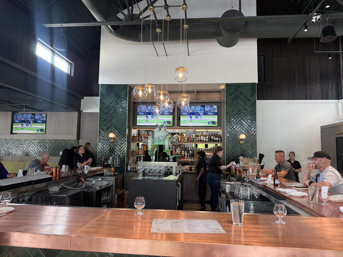 Third Street Social offers cocktails alongside American entrees like fried chicken.