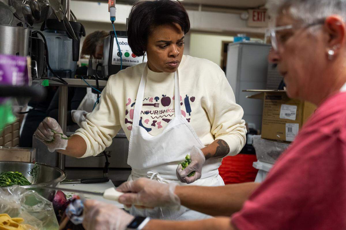 Chef Shanita McAfee-Bryant helps to prepare a meal at The Prospect KC, a community kitchen, on Thursday, November 6, 2025, in Kansas City. Homeless customers are able to come and eat a hot meal complete with service and a free pantry.