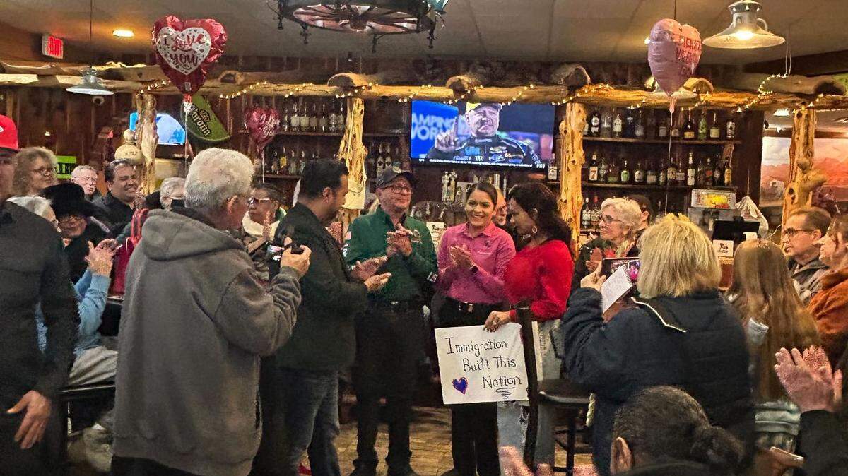 From left: Manny Abarca, Chico De La Torre, Yadira De La Torre and Helen Ortiz speak with Liberty residents and community members in the aftermath of a Homeland Security/Immigration and Customs Enforcement raid at El Potro Mexican Cafe and Cantina in Liberty.