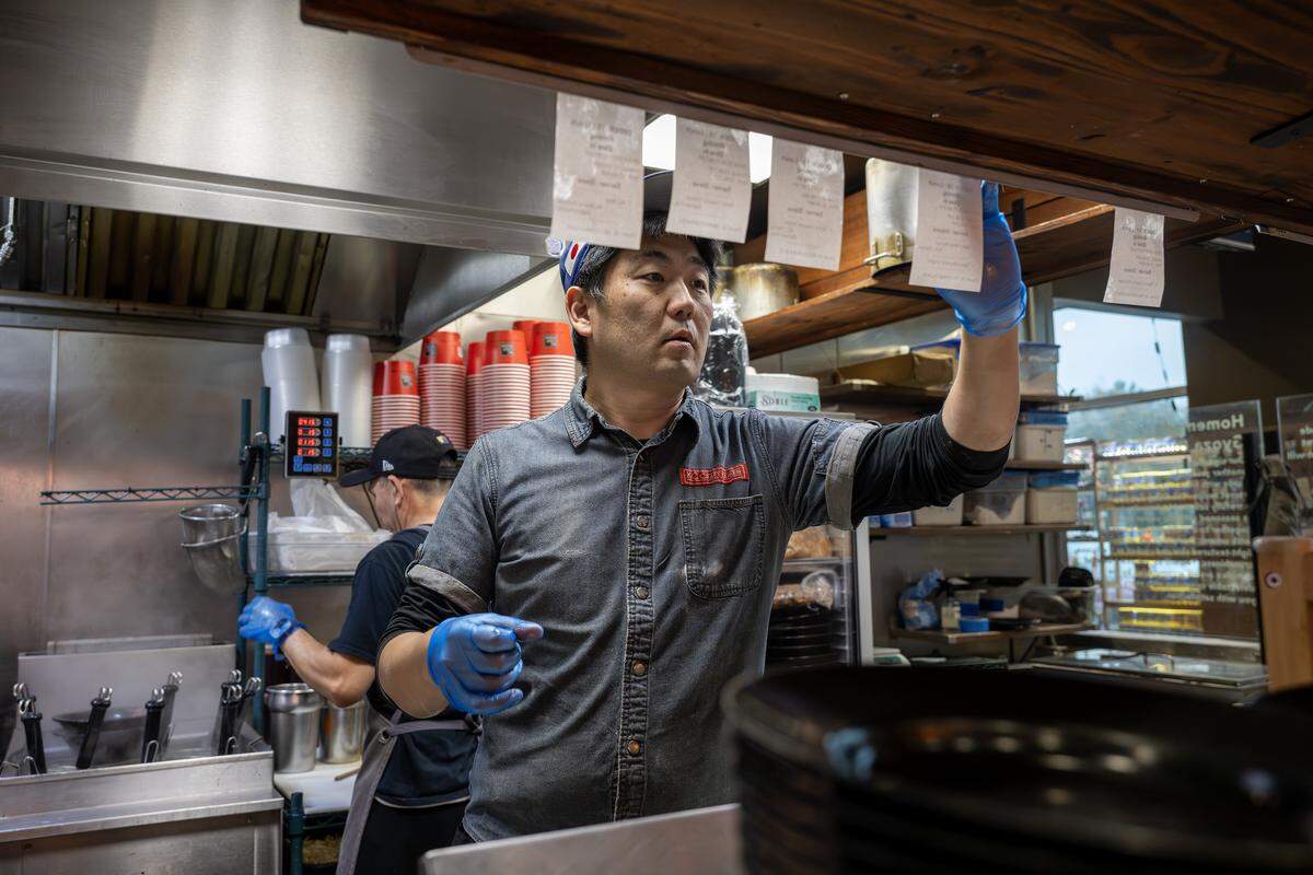 Kenichi Ota, owner of KC Craft Ramen, looks over orders to prepare on Wednesday, Oct. 29, 2025, in Overland Park.