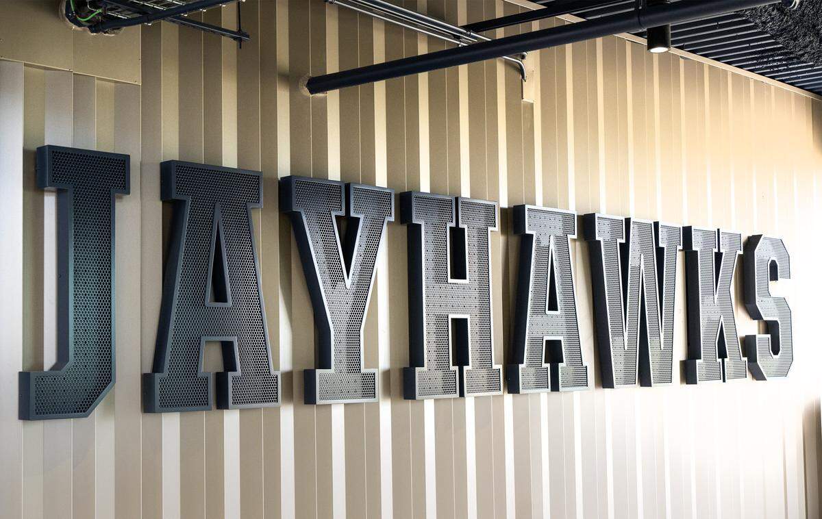 The name Jayhawks in oversized letters adorns a wall seen during a tour showing off the $450 million renovations at David Booth Kansas Memorial Stadium.