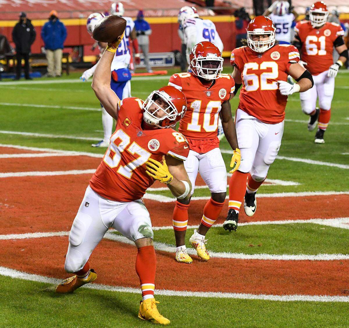 Kansas City Chiefs tight end Travis Kelce spikes the ball to celebrate his fourth quarter touchdown in the AFC Championship Game between the Chiefs and the Buffalo Bills on January 24, 2021. 