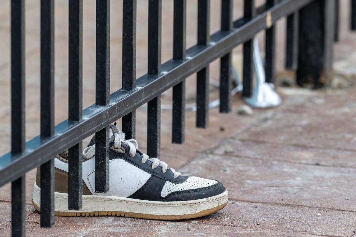 Personal effects were scattered outside of 2801 Southwest Blvd. following an early morning shooting on Sunday, Feb. 15, 2026. Two women were killed and two others injured during the incident at a Kansas City nightclub.