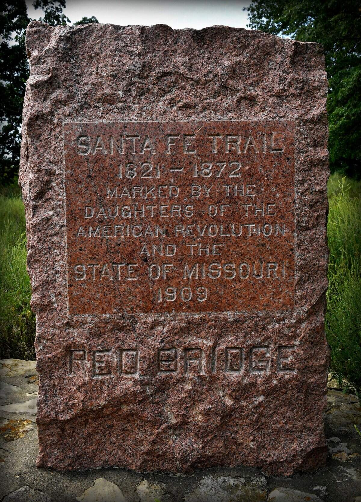 The swales left by wagons on the Santa Fe Trail after they crossed the Blue River are visible at this site in Minor Park.