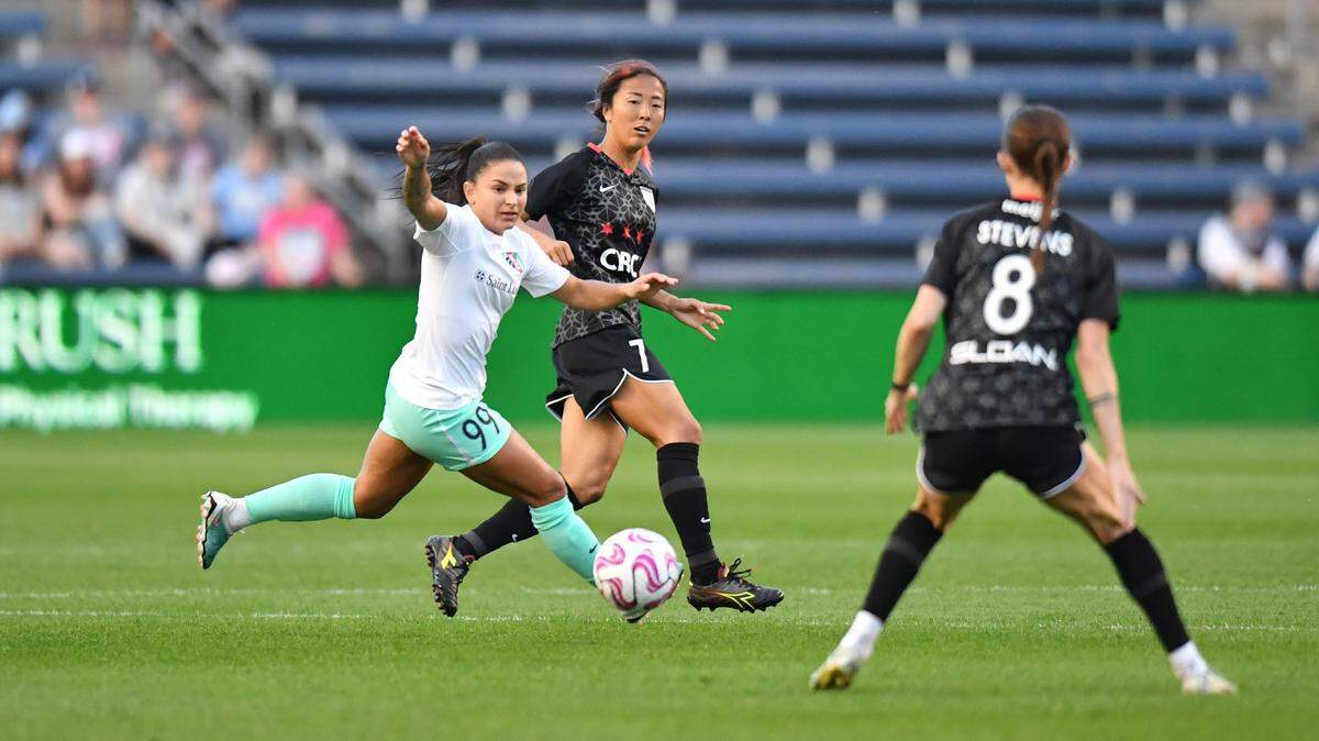 Chicago forward Yuki Nagasato is chased by Kansas City Current midfielder Debinha at SeatGeek Stadium in Bridgeview, Illinois, on April 15, 2023.