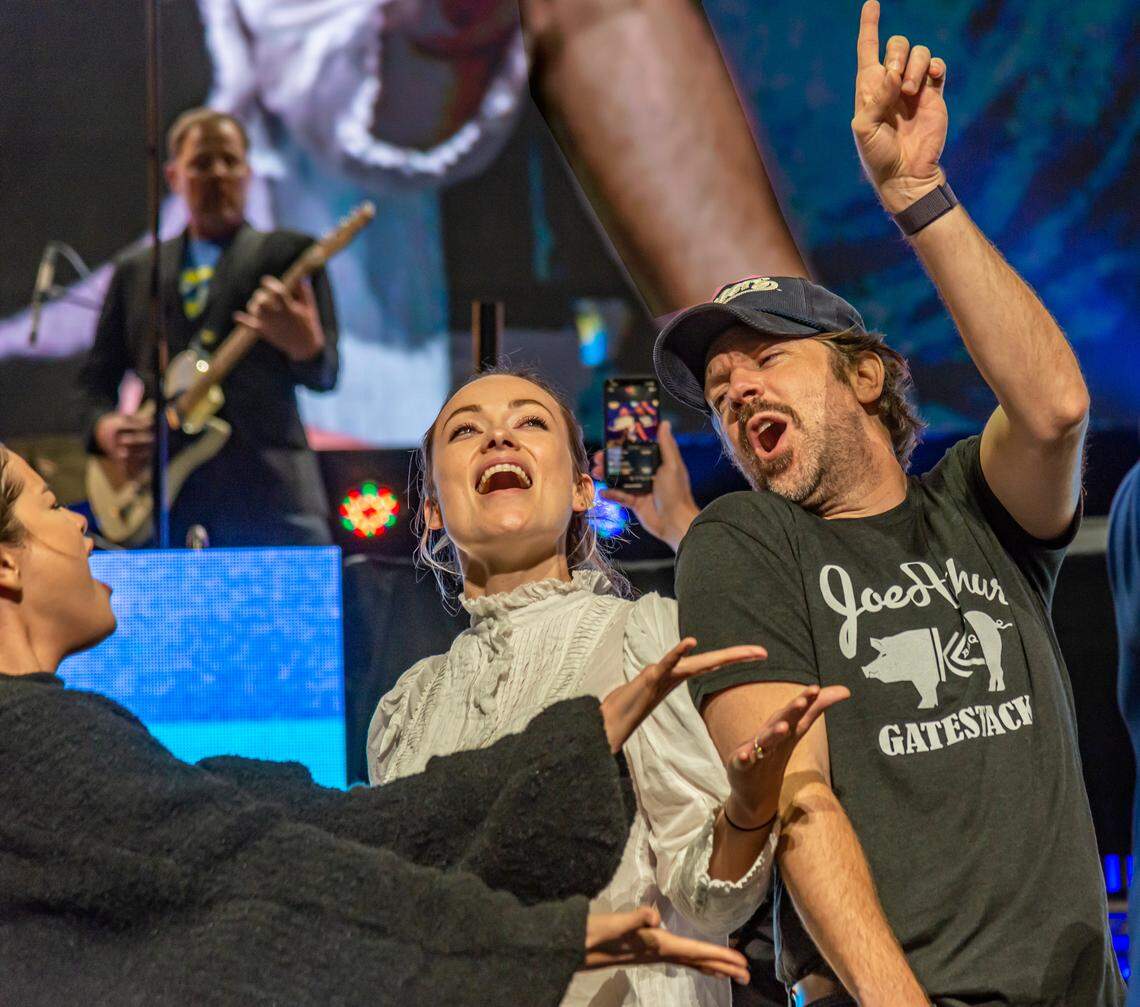 At the 2019 Big Slick Celebrity Weekend auction, Jason Sudeikis wore one of the first T-shirts his friend Brendan Curran created, honoring Kansas City barbecue. Sudeikis was joined onstage by Selena Gomez, left, and his then-fiancee, Olivia Wilde.