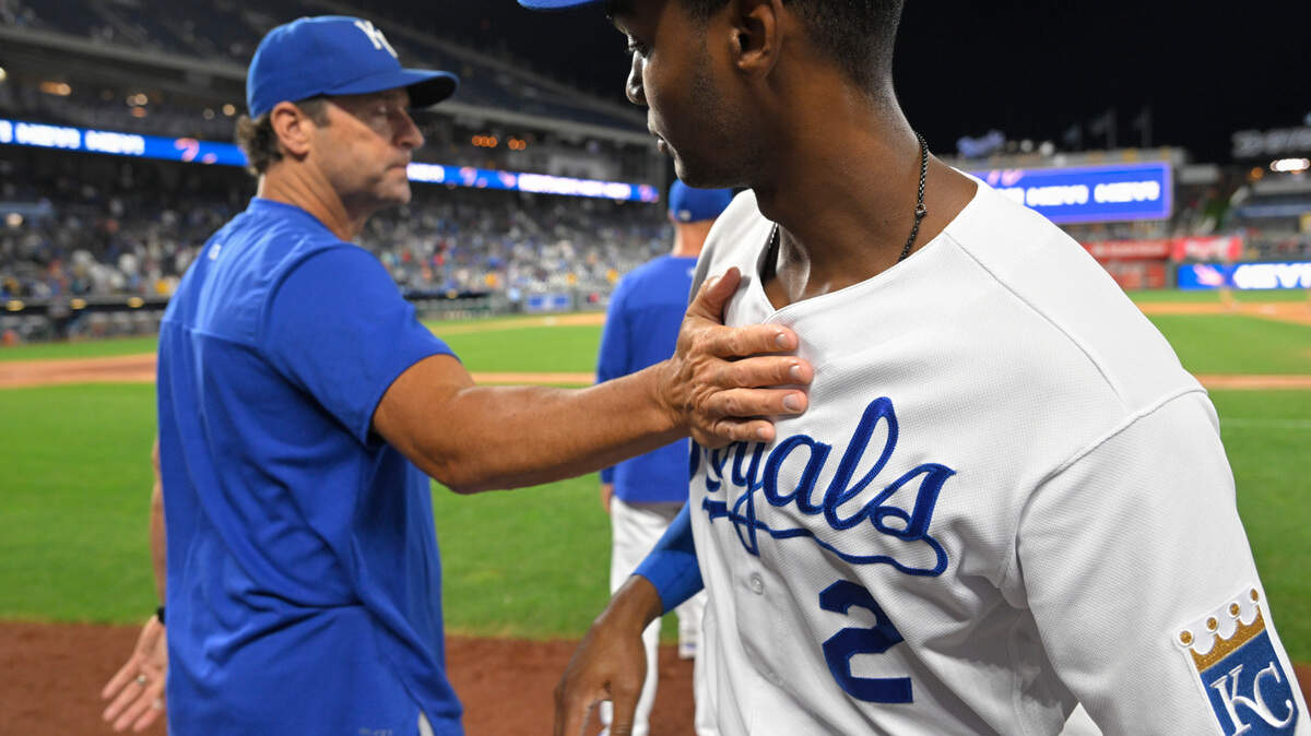 Kansas City Royals manager Mike Matheny, left, congratulates Michael A. Taylor, right, after they defeated the Los Angeles Angels in a baseball game, Monday, July 25, 2022, in Kansas City, Mo. (AP Photo/Reed Hoffmann)