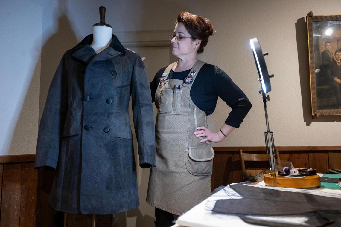 Textiles conservator Holly Messinger is working on the preservation of a man’s frock coat (1853-1856) at the Arabia Steamboat Museum in Kansas City on Thursday, April 18, 2025. This garment was among the 200 tons of cargo salvaged from the Steamboat Arabia, which sank in the Missouri River west of Kansas City in 1856. According to Messinger, such a coat likely sold for about $15 at the time.