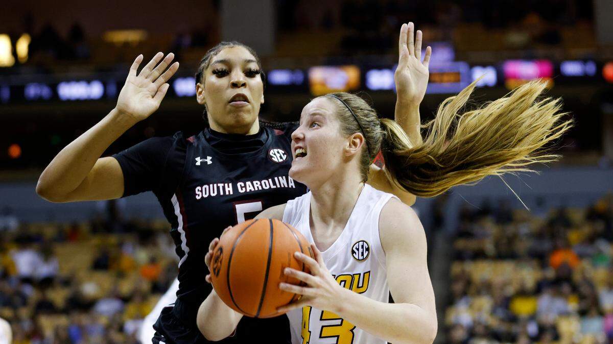 Missouri forward Hayley Frank (43) attempts to score against South Carolina forward Victaria Saxton (5)during an NCAA college basketball game on Thursday, Dec. 30, 2021 in Columbia, Mo. (AP Photo/Colin E. Braley)