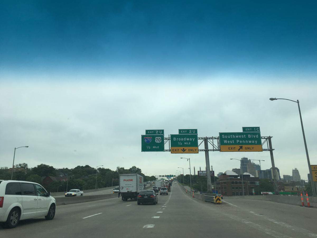 A sign on Interstate 35 mistakenly uses the symbol for a U.S. highway on an exit for Interstate 70. This photo was taken by a passenger, not the driver.