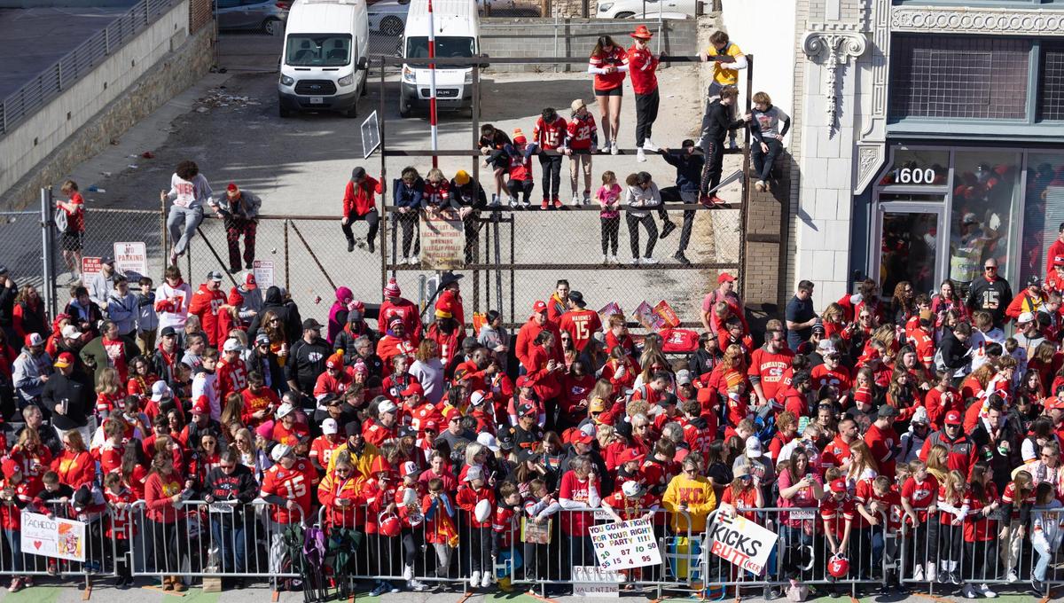 Chiefs fans gather along Grand Boulevard hours before the start of the Super Bowl parade on Wednesday.