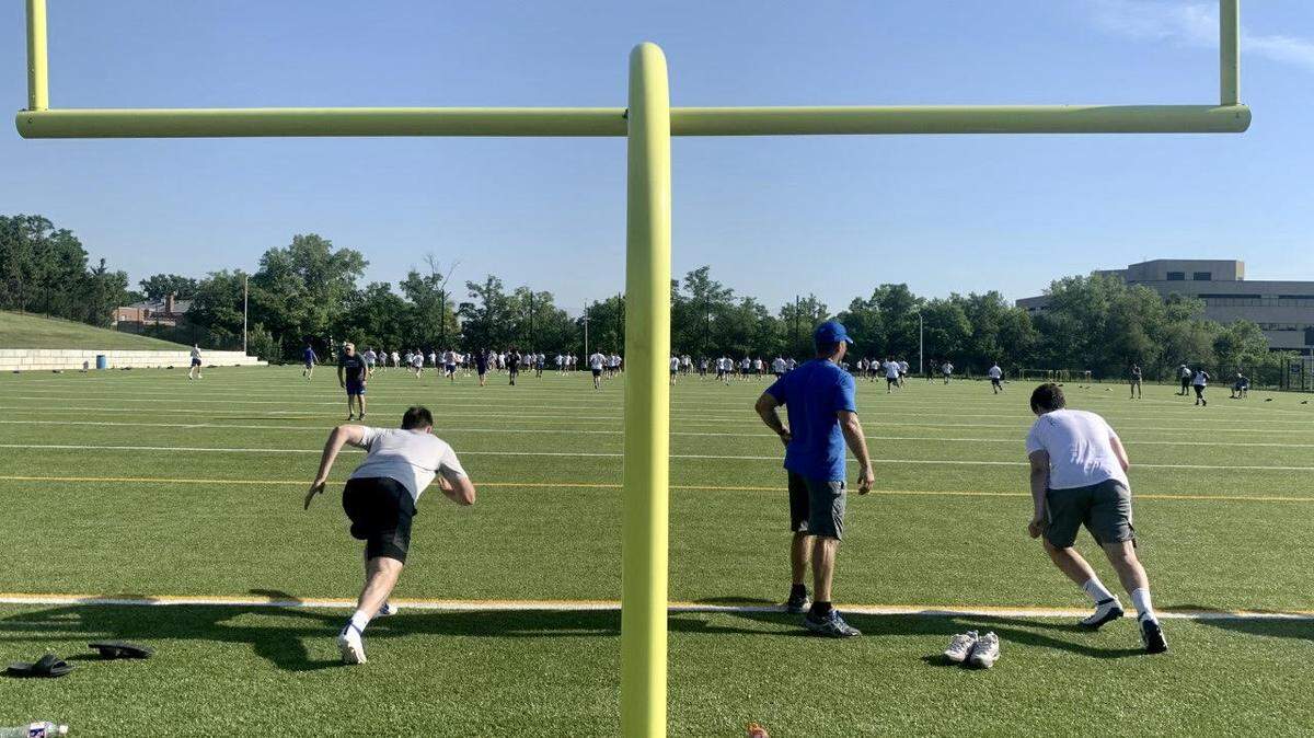 Rockhurst players run the field during the team’s first day of practice in anticipation of the fall high school football season. Rockhurst was one of many schools in the Metro that turned out Monday.