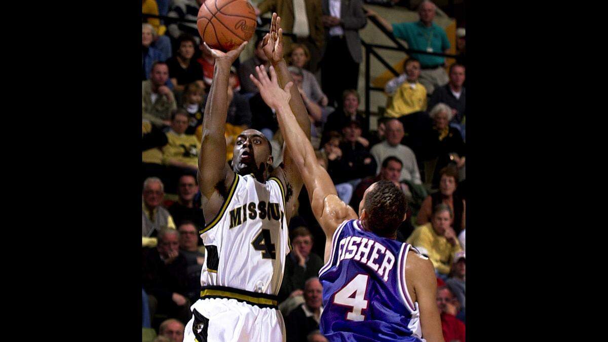 Mizzou’s Clarence Gilbert, left, drains a late and contested 3-pointer to help the Quin Snyder-coached Tigers beat the Lorenzo Romar-coached Saint Louis Billikens during a Dec. 9, 2000 men’s basketball game at the Hearnes Center in Columbia. The teams would meet again in 2001, but since then the rivalry has been dormant for a quarter-century.