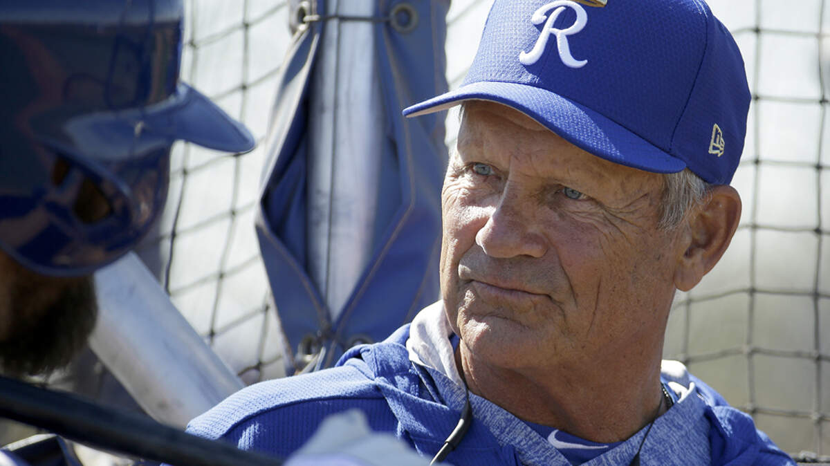 Kansas City Royals’ Alex Gordon, left, talks with Royals hall of famer George Brett during spring training baseball practice Wednesday, Feb. 20, 2019, in Surprise, Arizona.