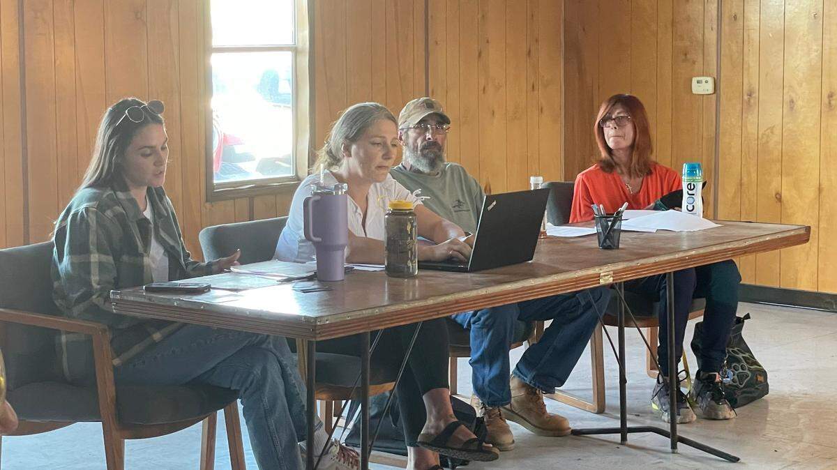 Members of the River Bend Board of Trustees hold a meeting in October 2023. From left to right: Alex Hill, the chair of the board, Amy Howse, the village clerk, James Hoppe and his wife Jessica Caswell.