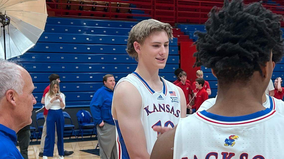 Johnny Furphy, middle, chats with staff member Doc Sadler, left, and fellow KU freshman Elmarko Jackson during Wednesday’s hoops media day at Allen Fieldhouse.