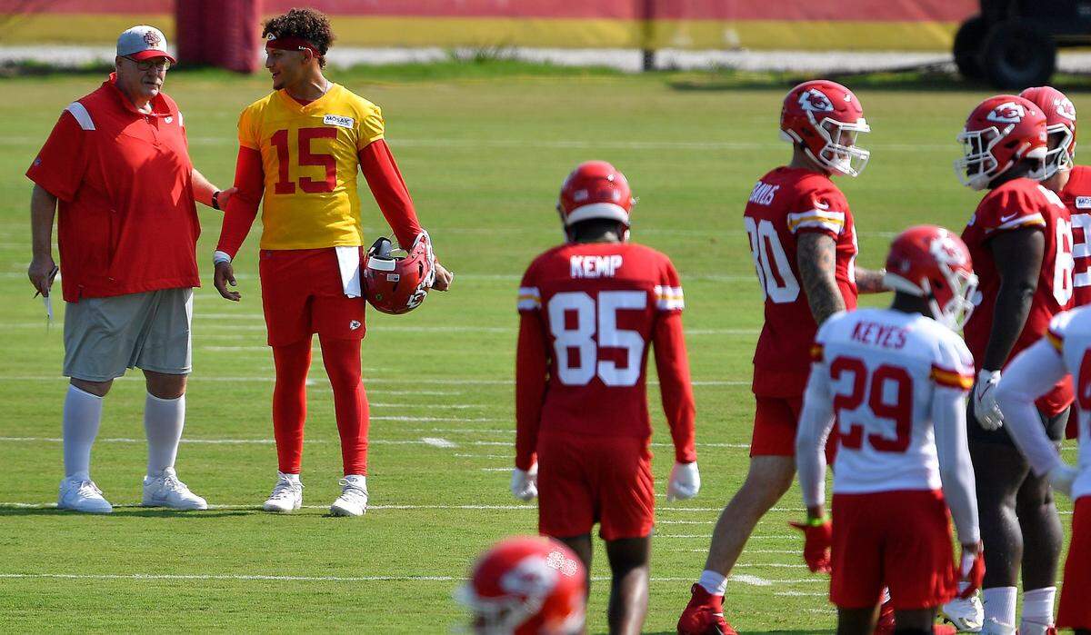 Kansas City Chiefs head coach Andy Reid chats with quarterback Patrick Mahomes during a practice at the 2021 summer training camp in St. Joseph, Missouri.
