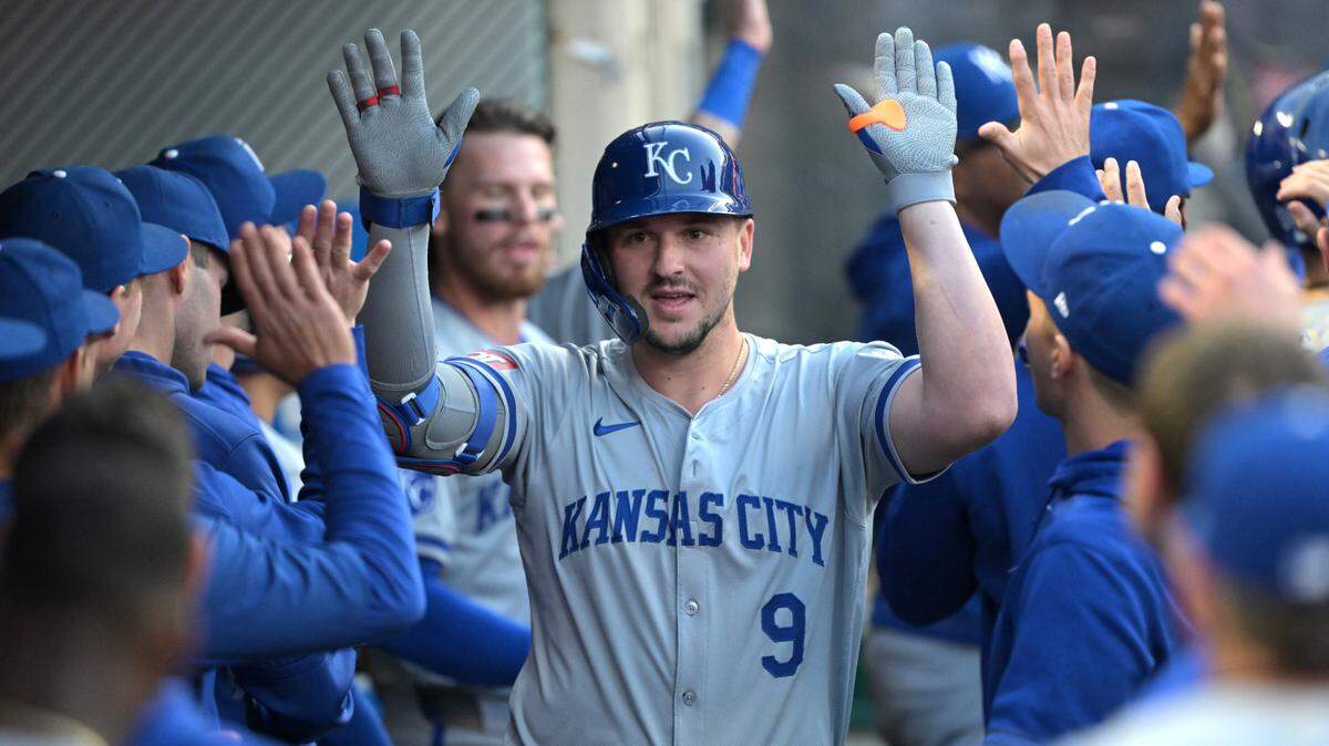 Kansas City Royals first base Vinnie Pasquantino (9) is congratulated in the dugout after hitting a two-run home run against the Los Angeles Angels in the third inning at Angel Stadium.
