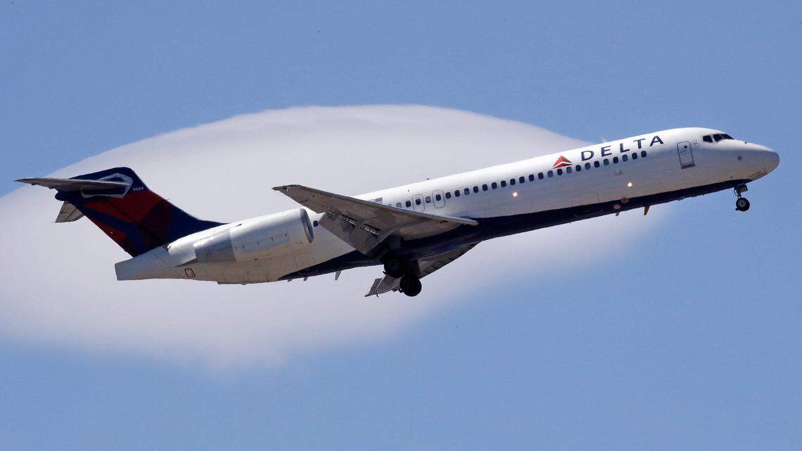 A Delta Air Lines passenger jet approaches Logan Airport in Boston in May 2018. An off-duty Delta employee is accused of sexually assaulting a passenger on a flight to Minneapolis, a federal lawsuit says.