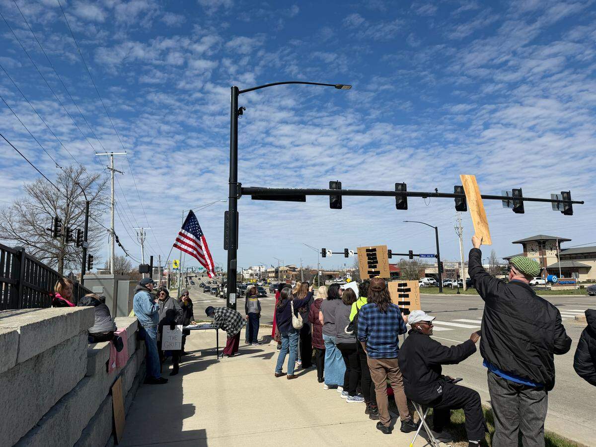 A crowd of protesters rallies along Kansas Street in Liberty during a nationwide wave of No Kings protests against President Donald Trump on Saturday, March 28.