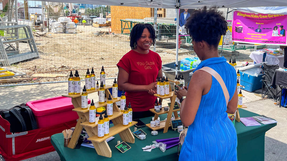 Iyshia Smith, owner of Amiracle Body Butters & More, at her booth at the Juneteenth Heritage Festival in Kansas City’s 18th & Vine Historic Jazz District on June 20, 2026.