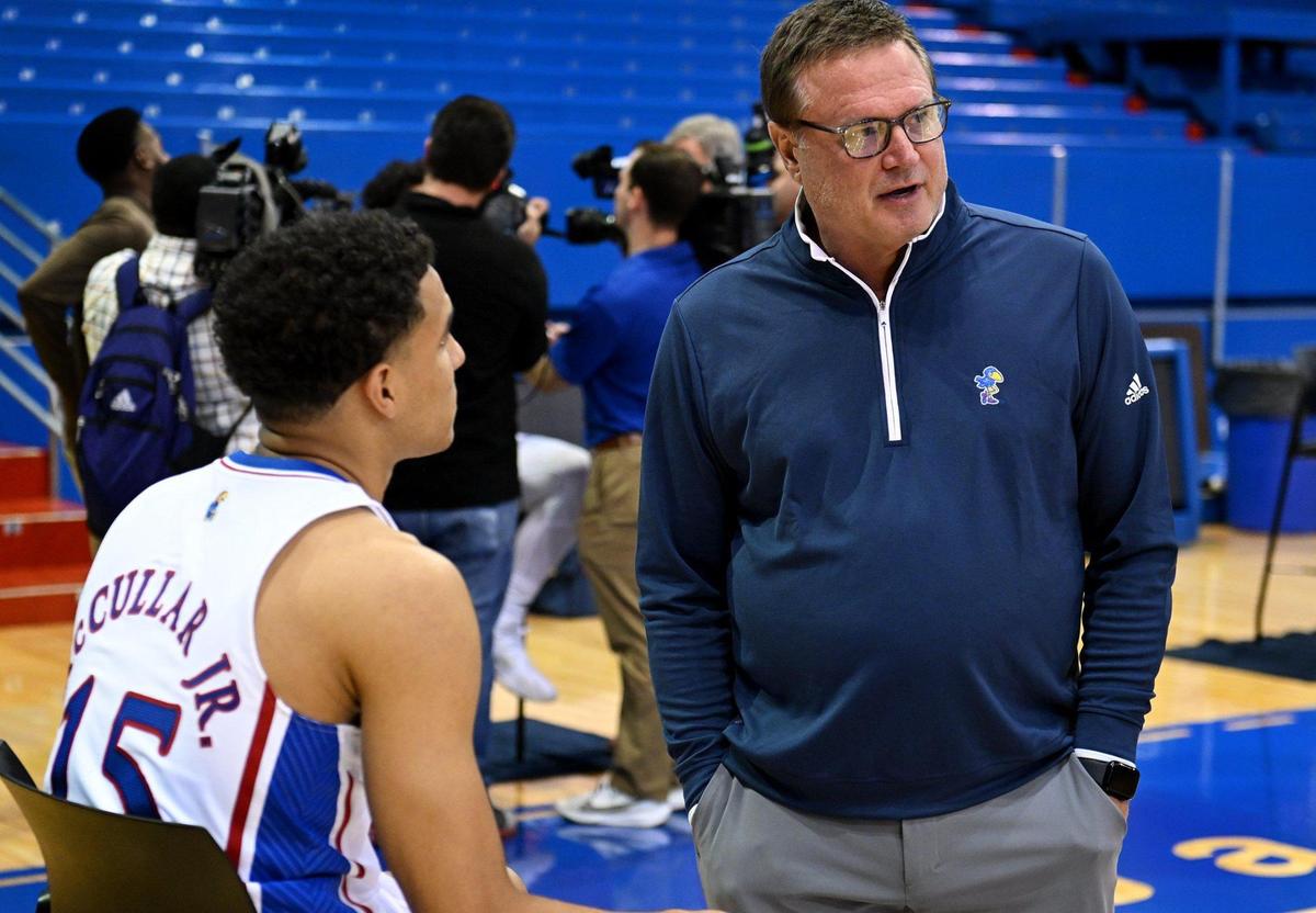 While reporters surrounded KU junior Jalen Wilson, rear, Kansas head coach Bill Self stepped in to have a few words with transfer guard Kevin McCullar during the Jayhawks’ annual media day at Allen Fieldhouse.