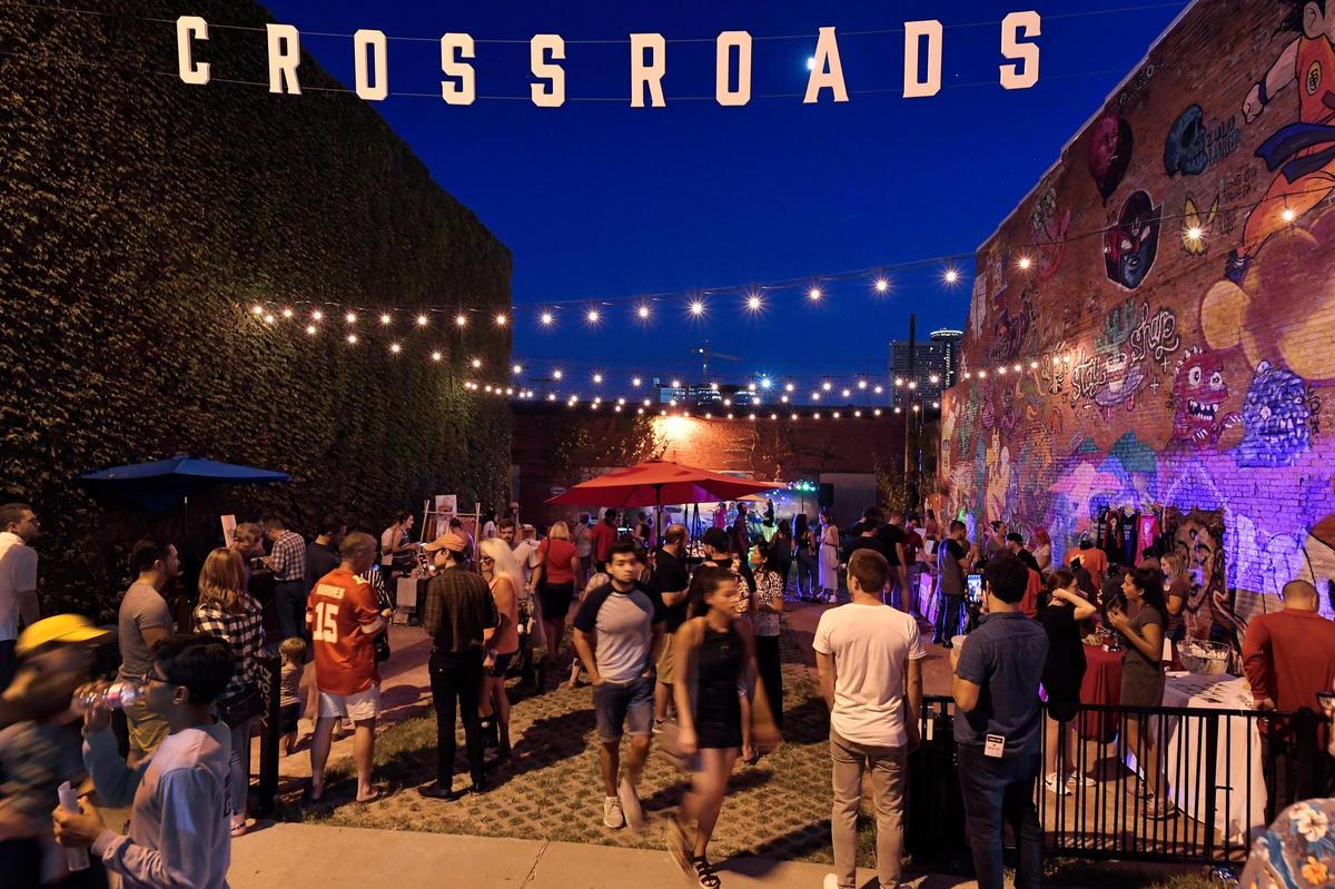 As live music filled the air in this nook of east Crossroads, attendees of First Friday mingled along 18th Street.