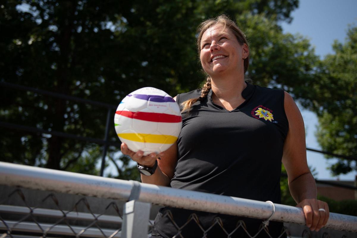 Leah Enright, Kansas State School for the Blind’s blind sports coordinator, stands in the bleachers near KSSB’s blind soccer field on Thursday, August 1, 2024, in Kansas City, Kansas