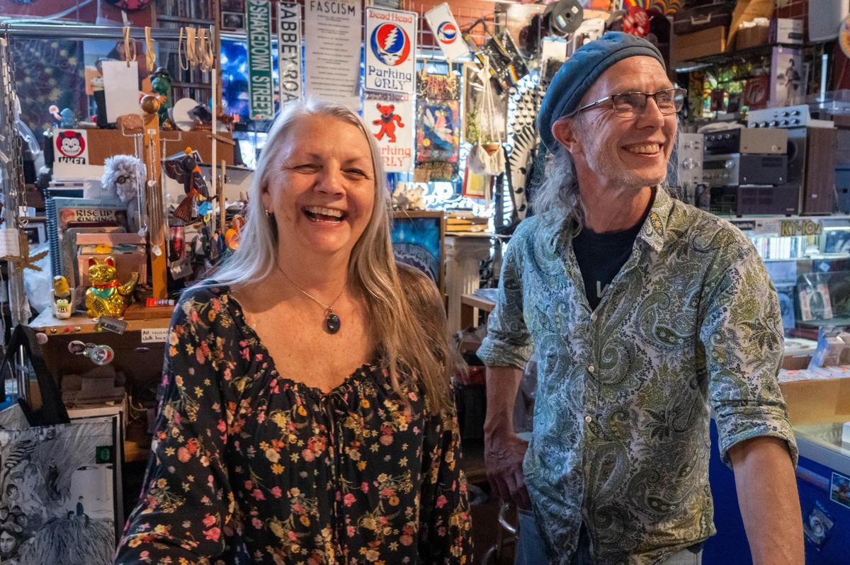 Owners Fran Stanton and Erik Branstetter work in their store, It’s a Beautiful Day, a boutique shop near 39th Street and Broadway in Kansas City on Wednesday. The shop, which has been open for 35 years, sells art, clothing, vinyl and music equipment.