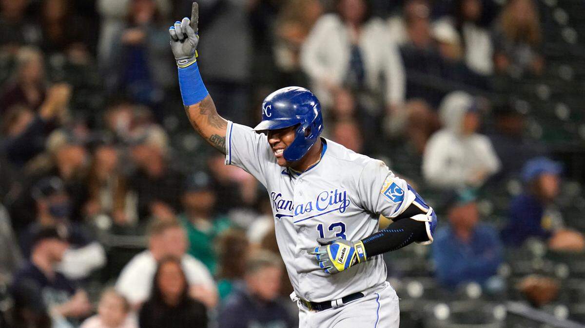 Kansas City Royals’ Salvador Perez points skyward as he heads home on his grand slam against the Seattle Mariners in the fourth inning of a baseball game Friday, Aug. 27, 2021, in Seattle. (AP Photo/Elaine Thompson)