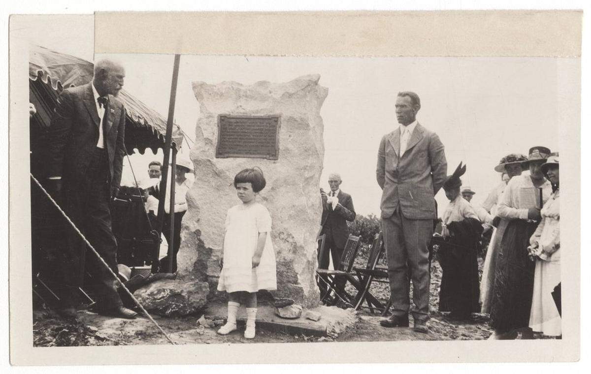 Sue Wornall, the great-great-granddaughter of mission founder Rev. Thomas Johnson, posed in front of the monument with Bishop Eugene R. Hendrix, left,  and Judge Nelson Case during the 1917 dedication ceremony.