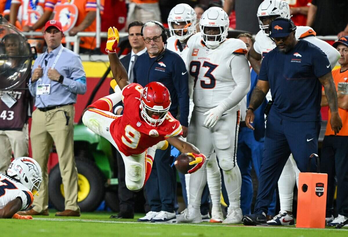 Kansas City Chiefs running back Kenneth Walker III (9) dives with the ball in the second quarter of the Kansas City Chiefs vs. Denver Broncos NFL season opener at Arrowhead Stadium in Kansas City on Sept. 14, 2026.