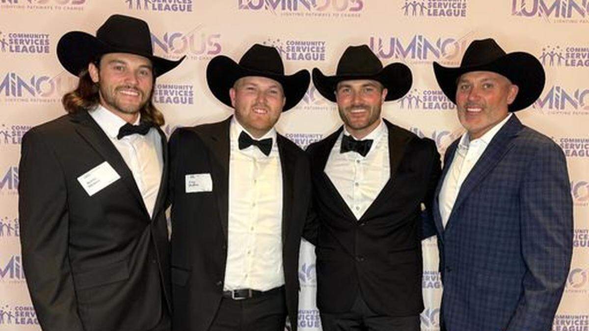 Steve A. McBee (right) with three of his four sons at a charity event for the Community Service League of Eastern Jackson County on Nov. 2, 2024 at the Loews Hotel in downtown Kansas City.